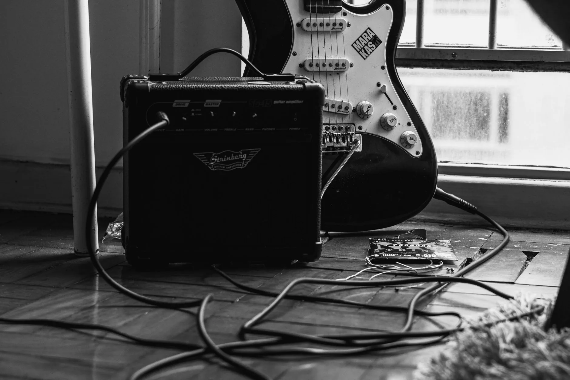 Dog-eared EQ cheat sheet on weathered light wood, soft muted lighting, film photograph style.